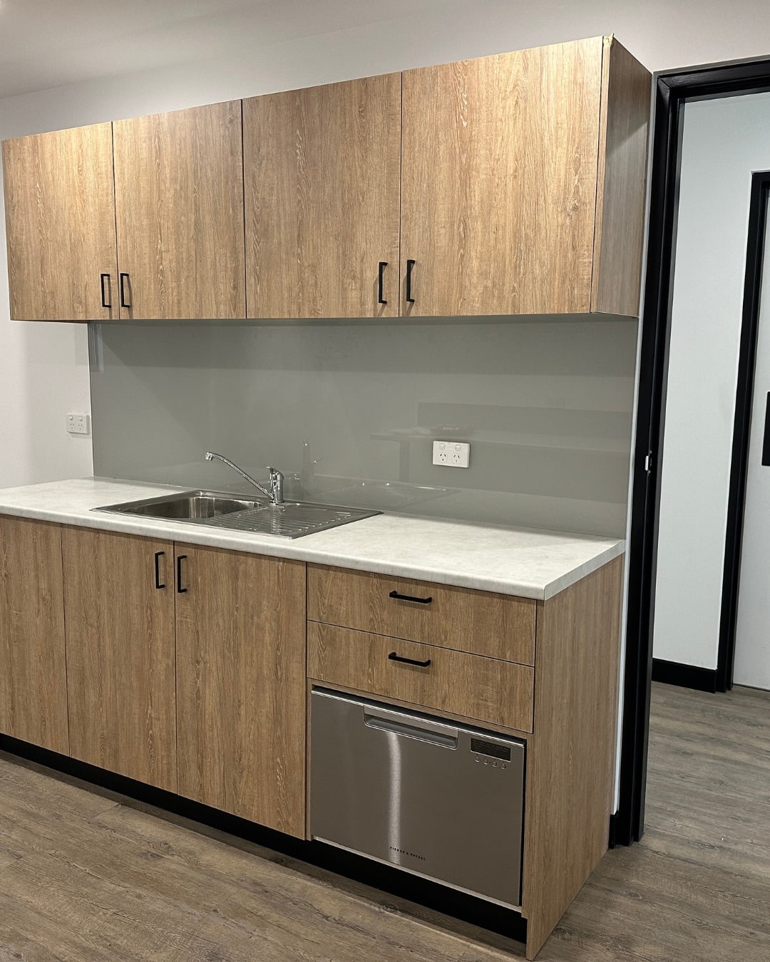 A clean, functional kitchenette built with quality finishes and practical design in mind. 

Thoughtful storage, durable materials and seamless integration come together to create a space that works as hard as you do.

JLW Fitout | Sydney, NSW

#jlwfitout #commercialfitouts #officefunctionality #smartworkspace #customjoinery